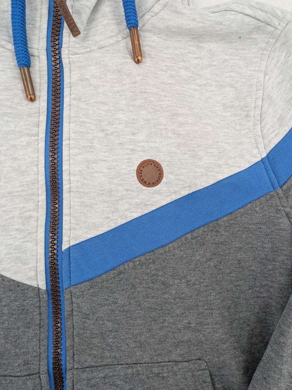 ALIFE turtle neck jumper blue grey colorblock design with logo details and soft cotton blend.
