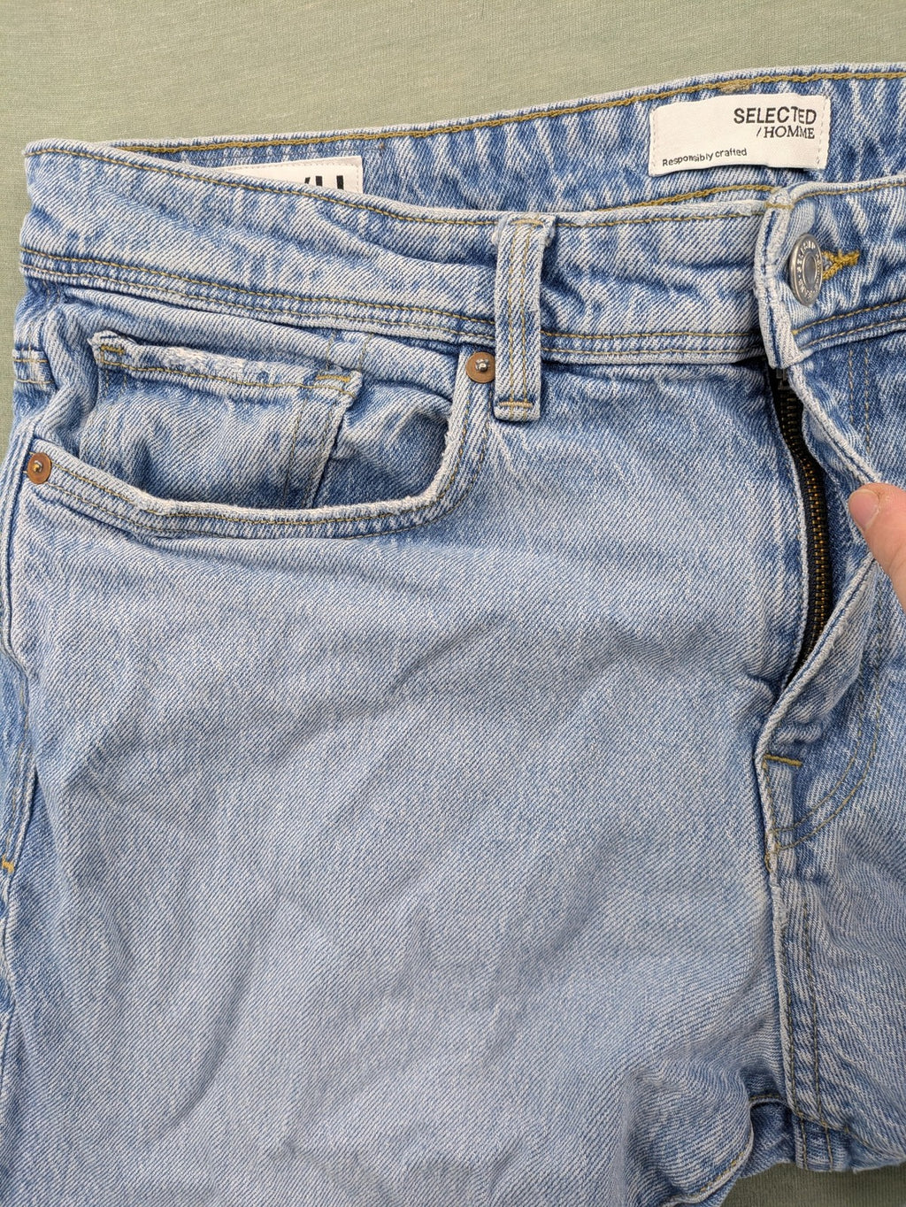 Selected Homme blue slim fit jeans with classic wash and stretch cotton material.