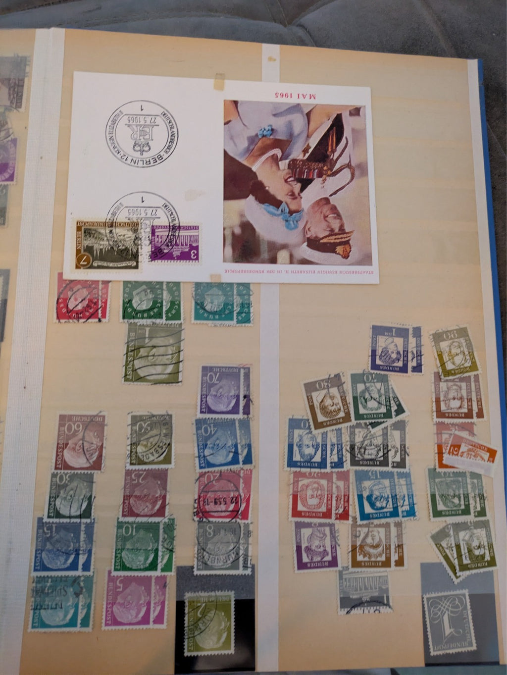 Beige postage stamp album featuring over 1000 stamps from Germany and Europe.