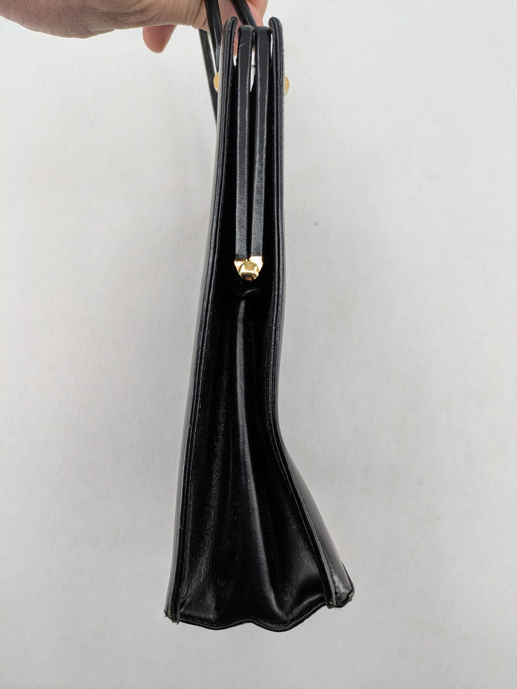Eleganz black messenger bag vintage 50s 60s style with structured shape and gold accents.