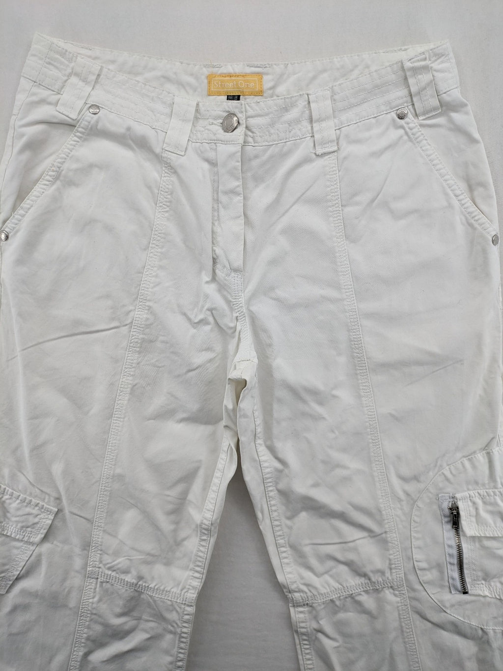 Street One white cargo pants with side pockets and wide leg design.