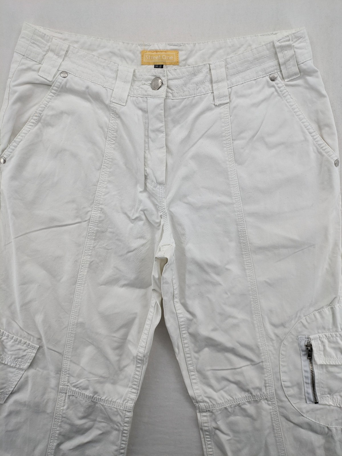 Street One white cargo pants with side pockets and wide leg design.