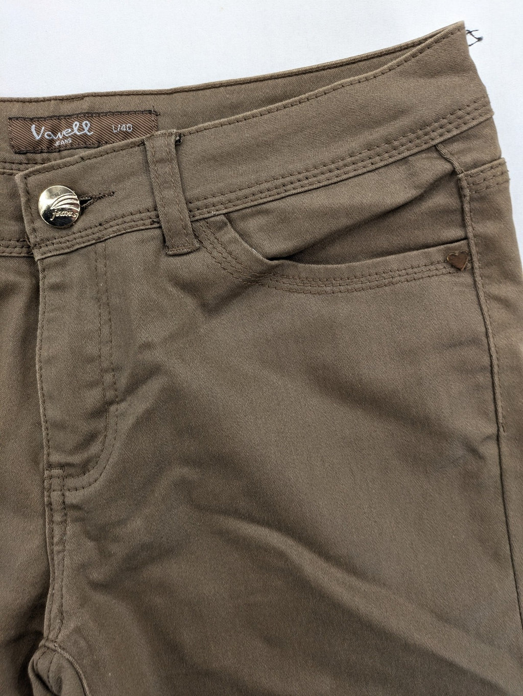 Vavell khaki skinny jeans five-pocket design with unique front zipper detail.
