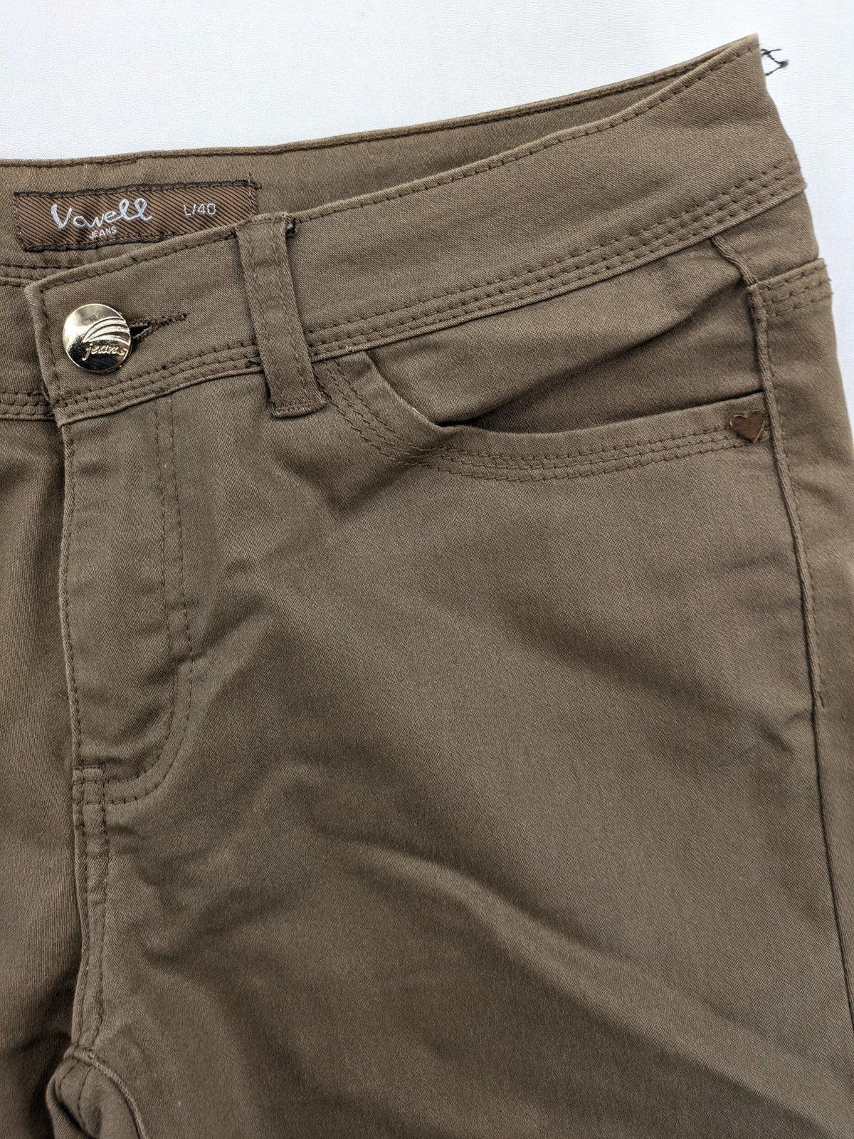 Vavell khaki skinny jeans five-pocket design with unique front zipper detail.