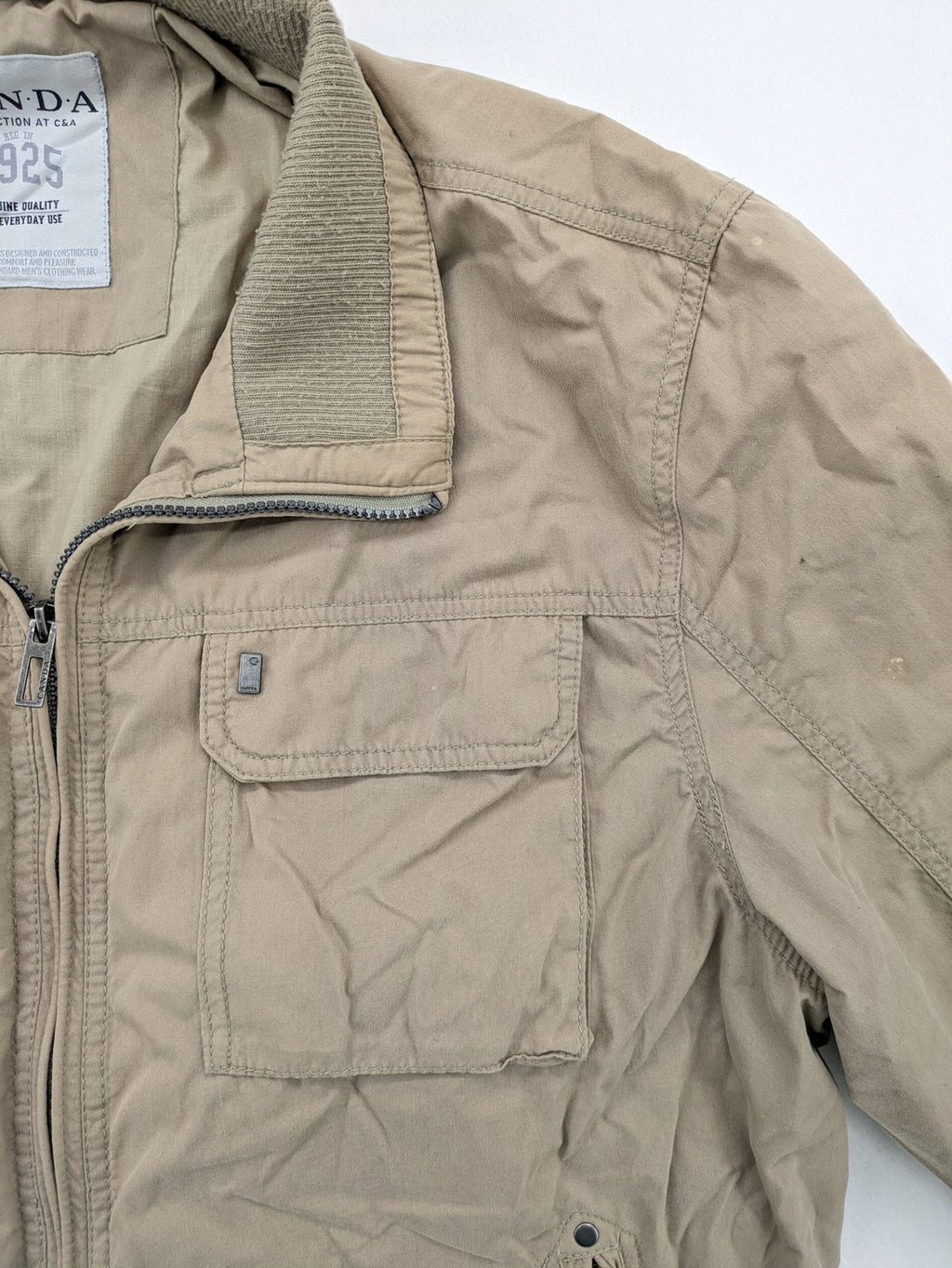 Canda beige bomber jacket full zip with ribbed collar and buttoned chest pockets.
