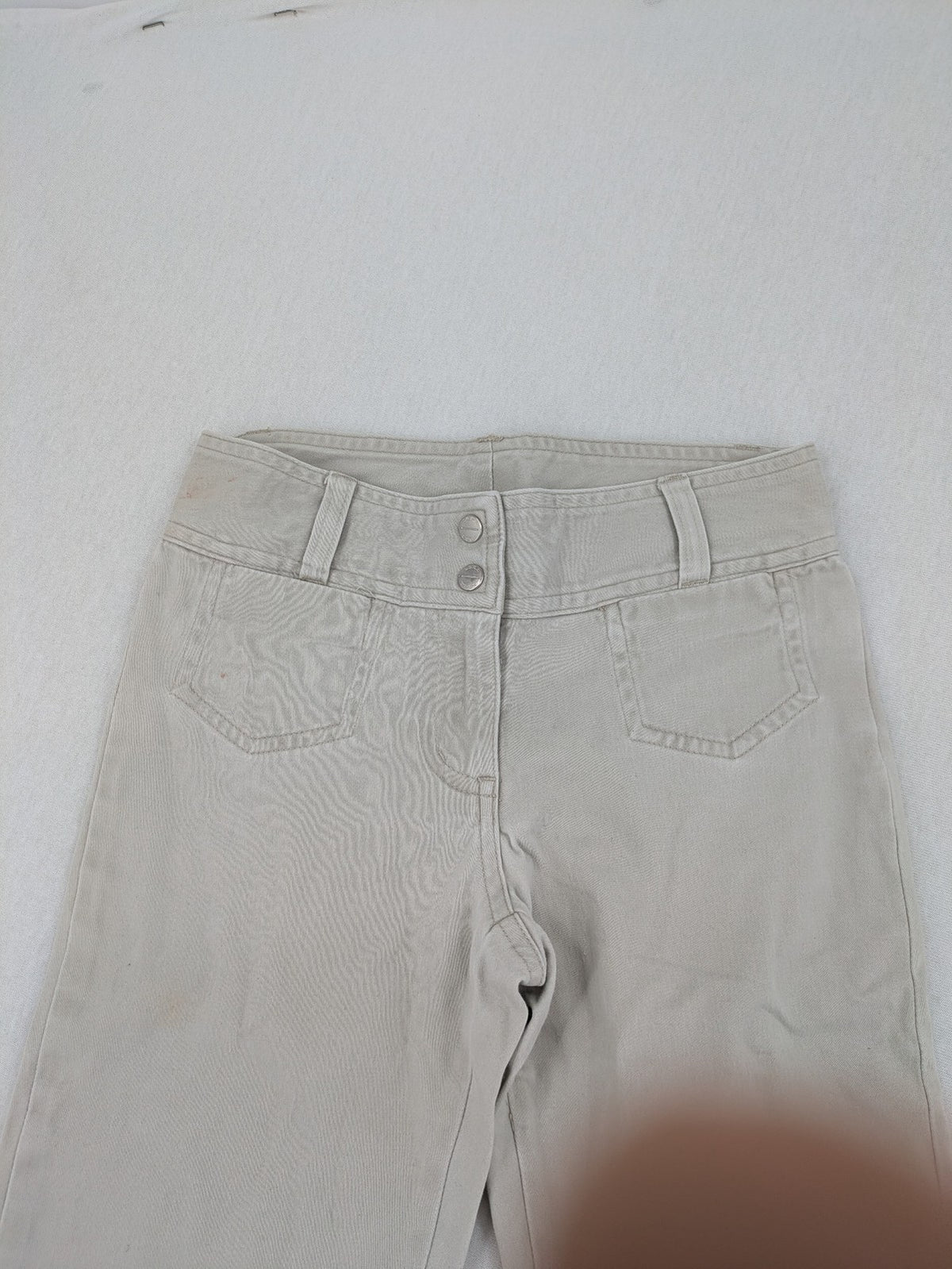 H&M L.O.G.G beige bootcut pants with double button closure and stretch cotton material.