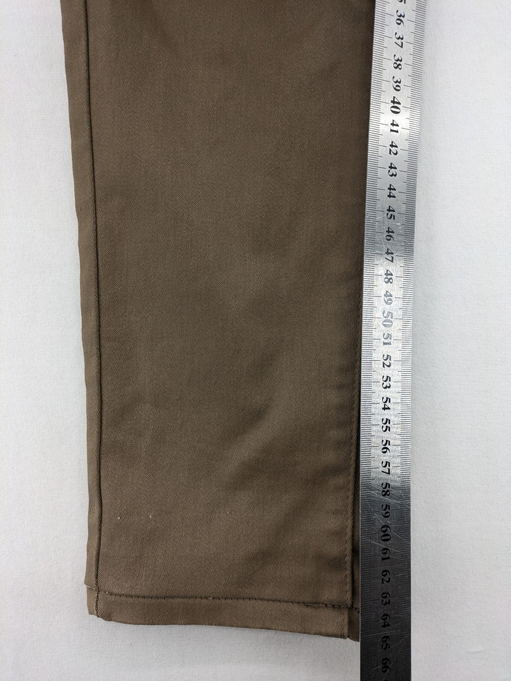 Vavell khaki skinny jeans five-pocket design with unique front zipper detail.
