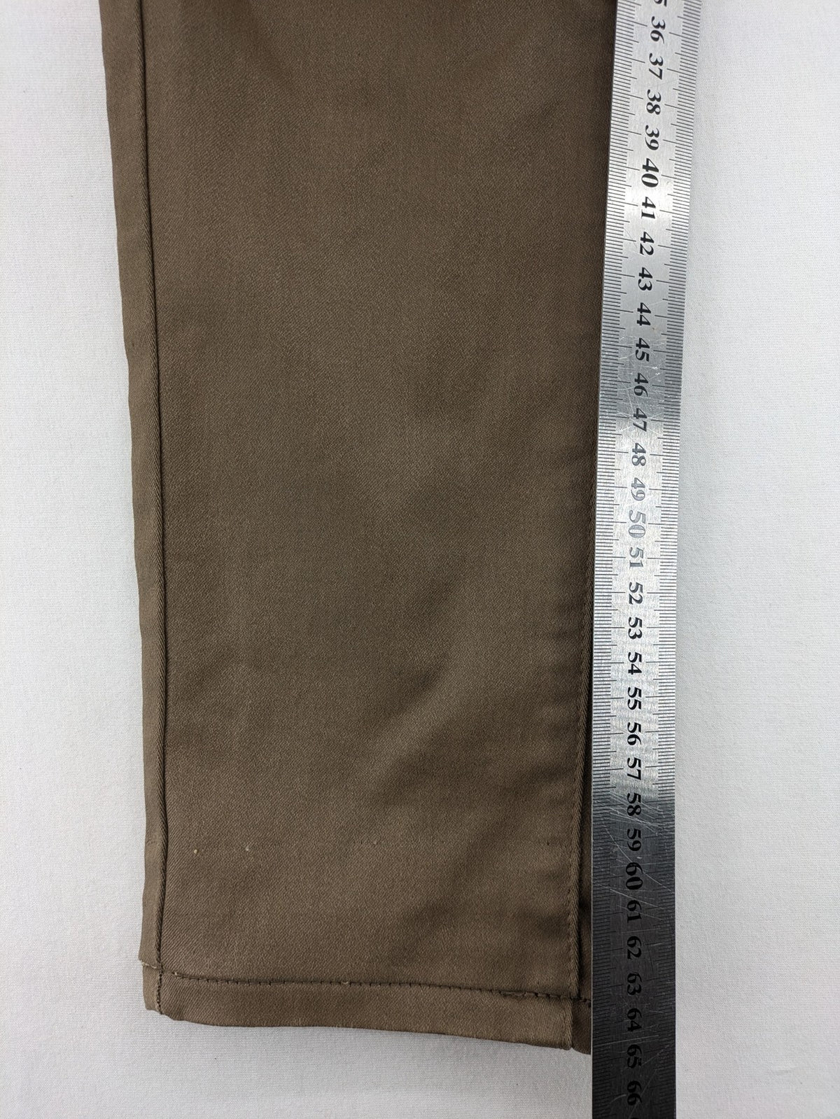Vavell khaki skinny jeans five-pocket design with unique front zipper detail.