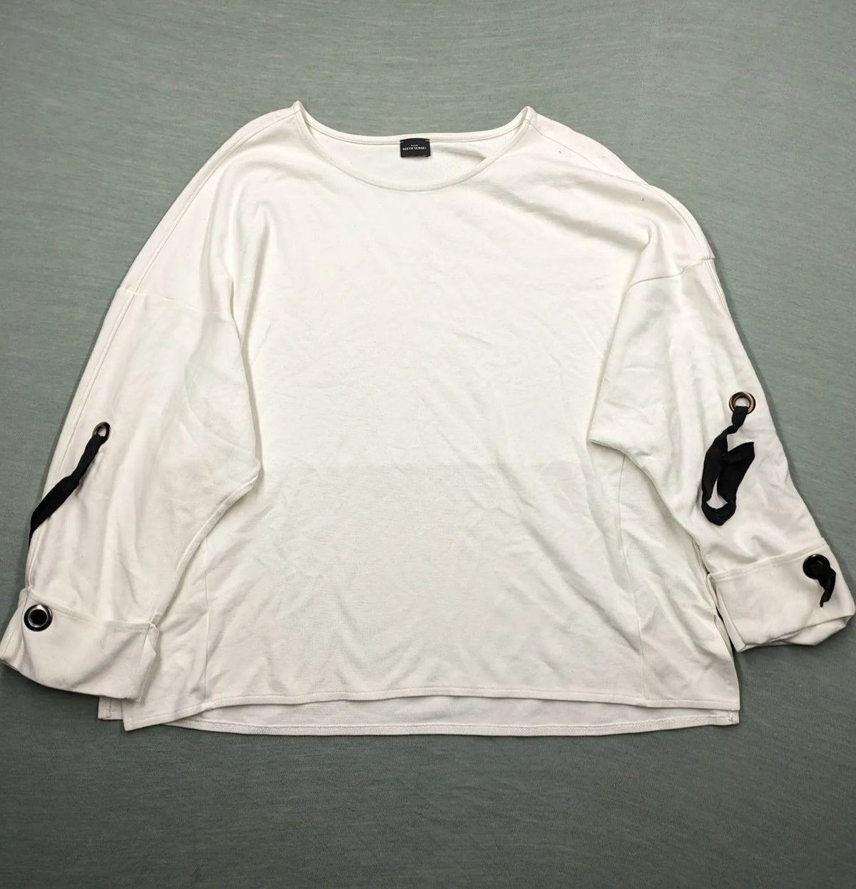 Your Sixth Sense black and white oversized turtle neck jumper with lace-up sleeve details.