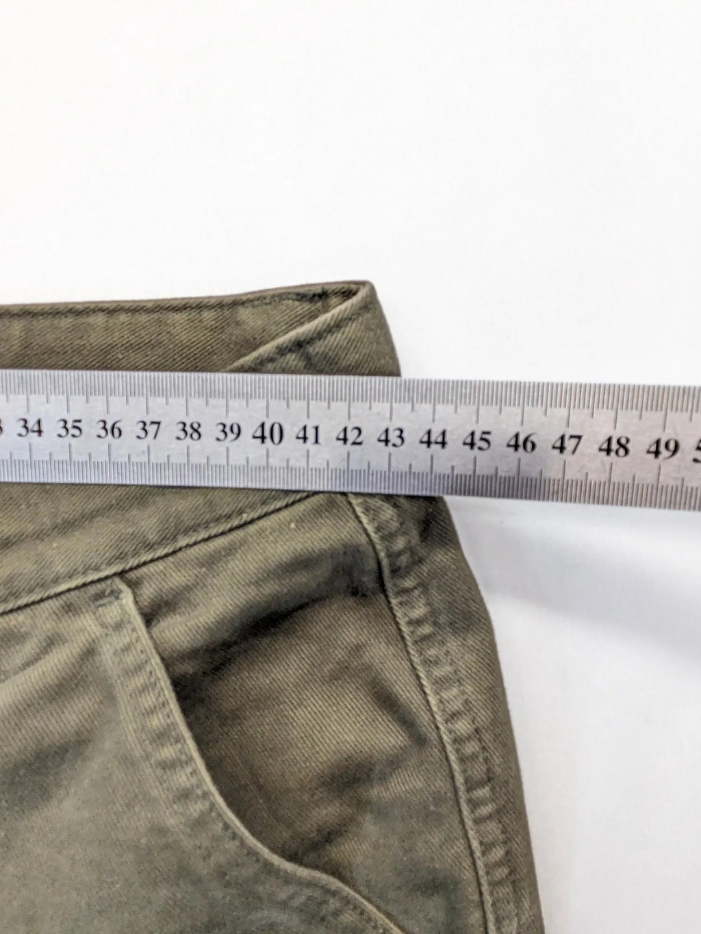 Lands' End green cargo pants with plaid flannel lining and traditional fit design.