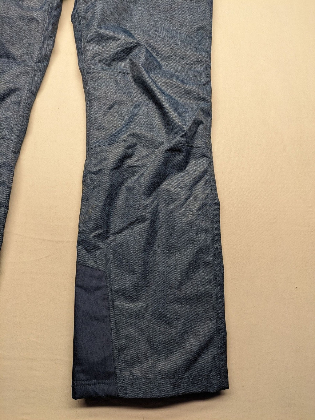 Snow Tech blue ski pants with modern denim look and durable polyester material.