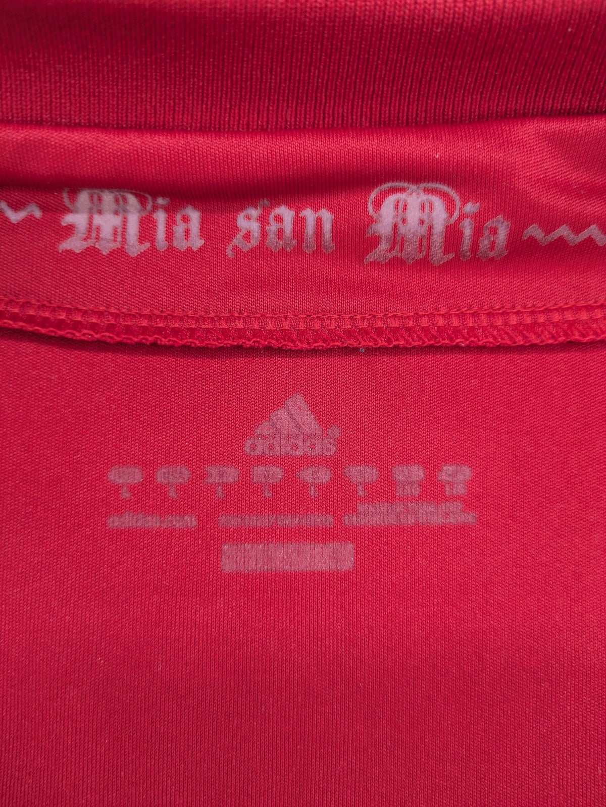 Adidas red soccer uniform with embroidered FC Bayern München crest and T-Mobile logo.