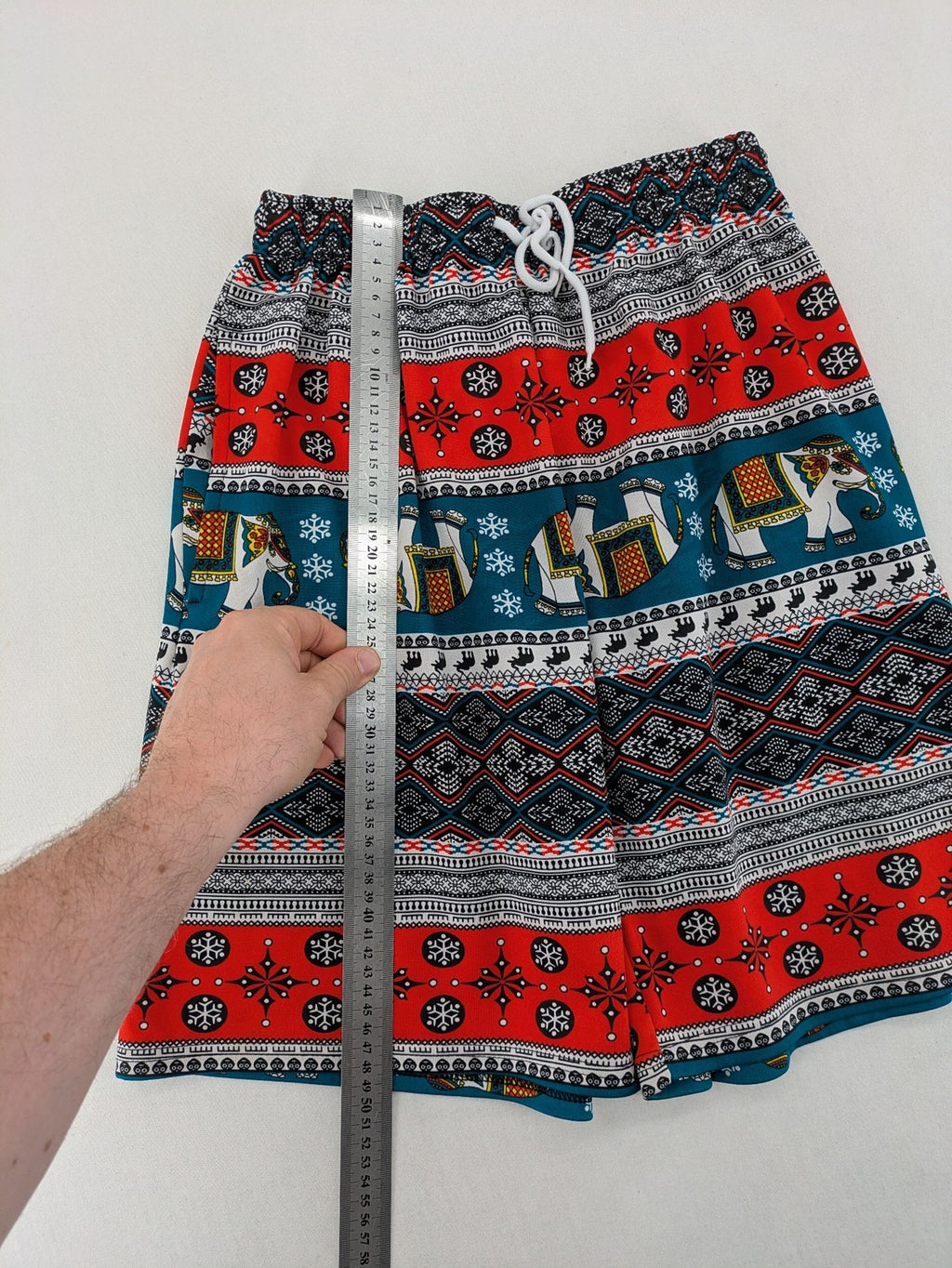 Elefanten multi shorts featuring vibrant elephant and geometric patterns with elastic waistband.