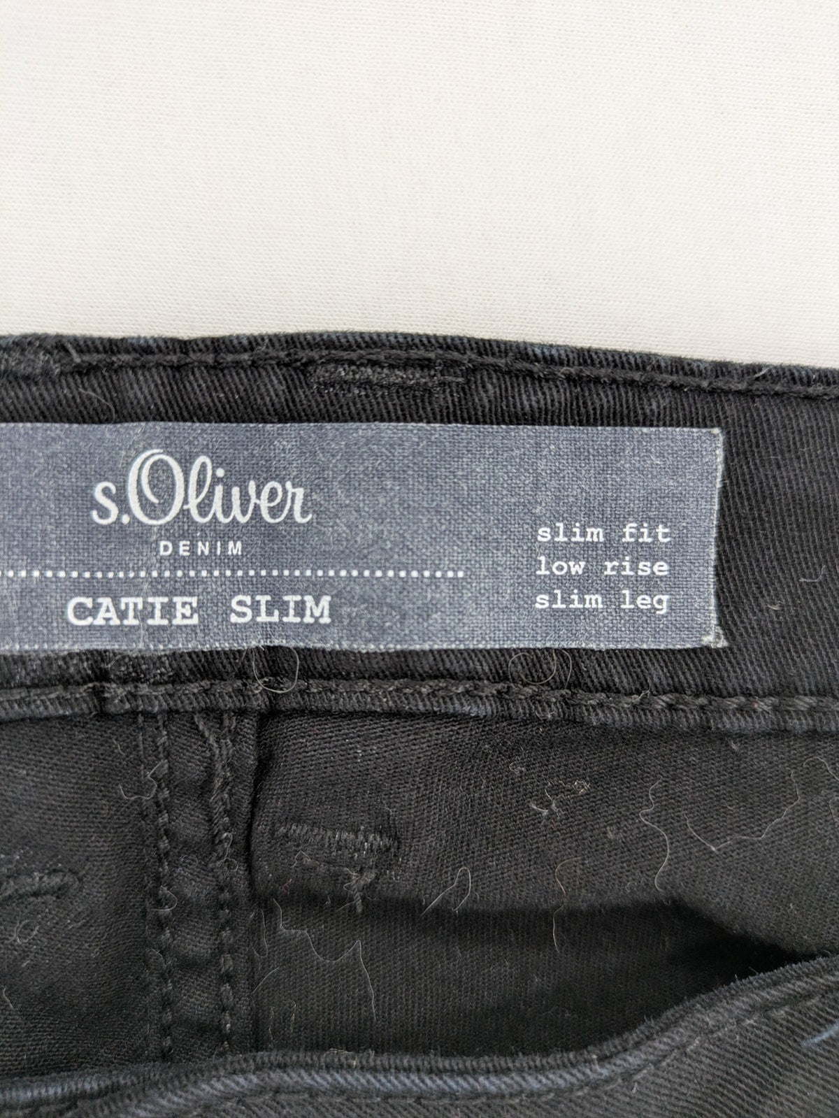 s.Oliver black slim fit jeans with low rise and classic design details.