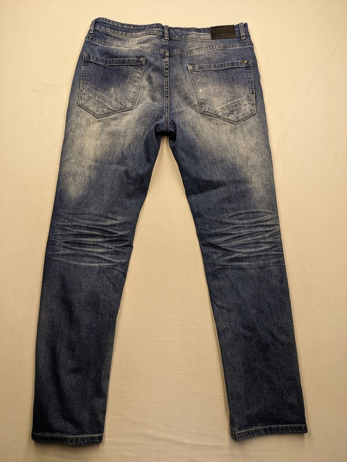 Brandit blue straight jeans with distressed details, button fly, and classic 5-pocket style.