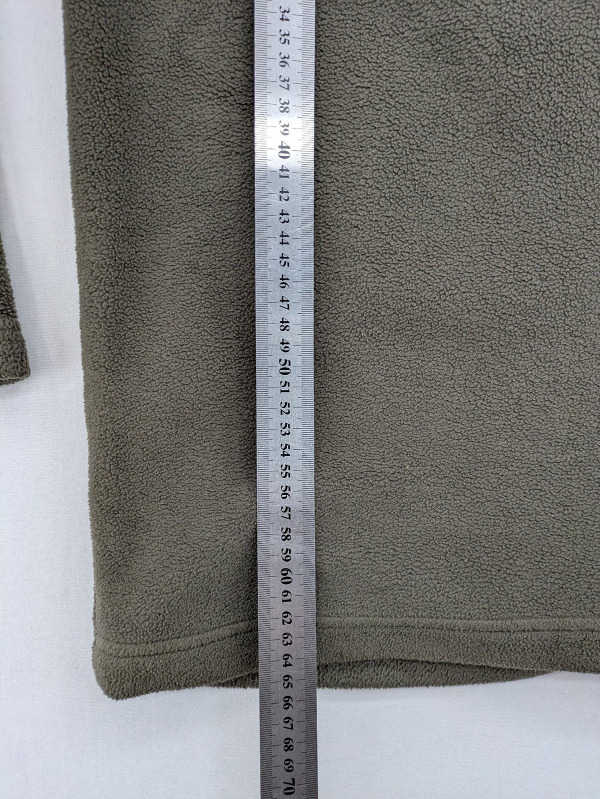 Jack Wolfskin khaki turtle neck jumper with quarter zip and embroidered paw logo.