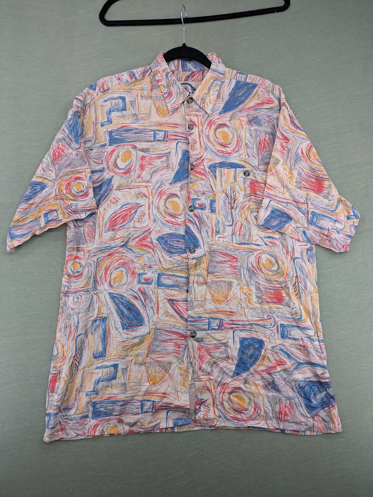 Limit short-sleeve shirt multi-coloured abstract pattern, lightweight viscose, chest pocket detail.