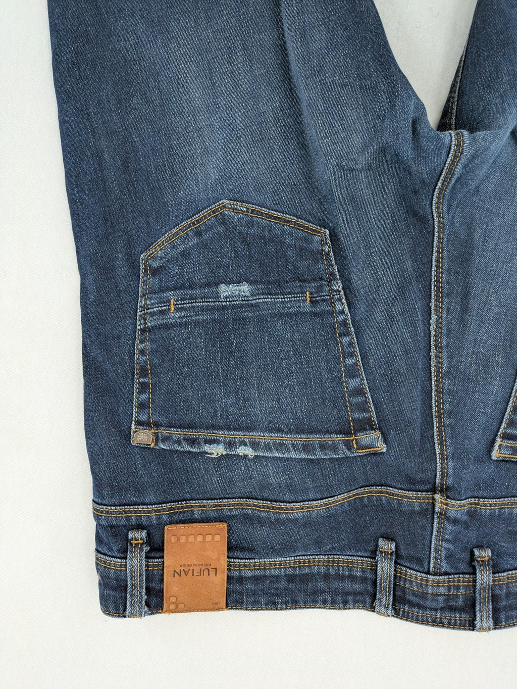 Lufian blue straight jeans dark wash distressed 5-pocket style with stretch denim.
