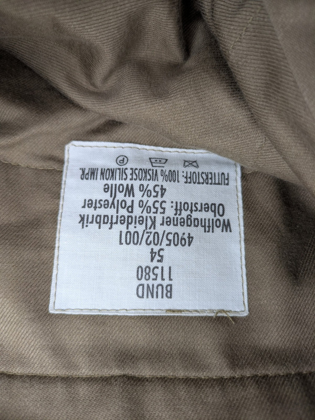 Bundeswehr khaki military uniform trousers with front pleats, zipper, and belt loops.