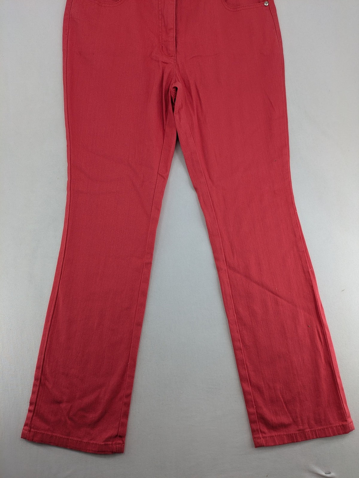 Helena Vera red straight jeans with elastic waistband and rhinestone details on pockets.