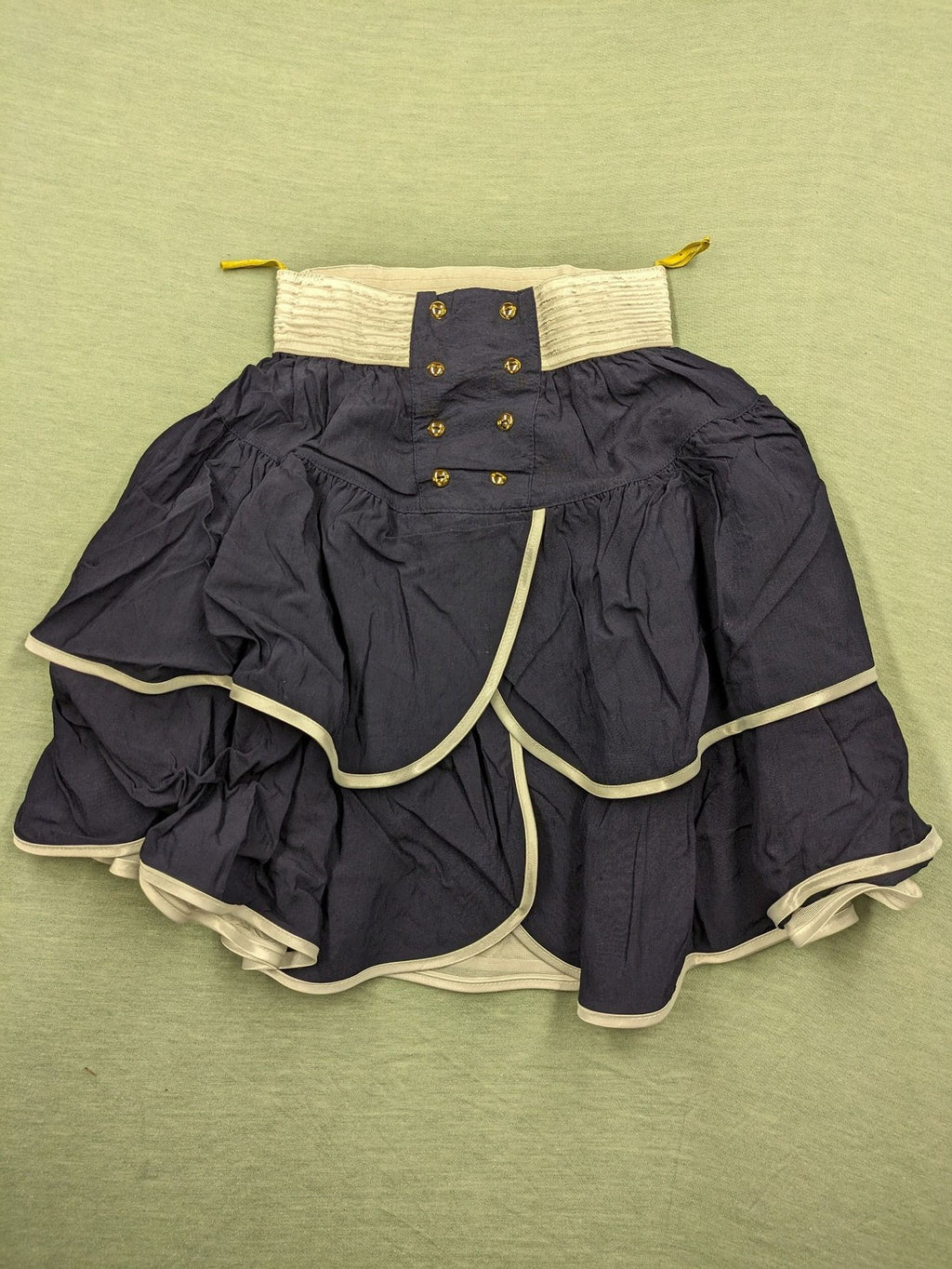 C&A knee-length skirt cream and navy, high waist with tiered ruffles and gold buttons.