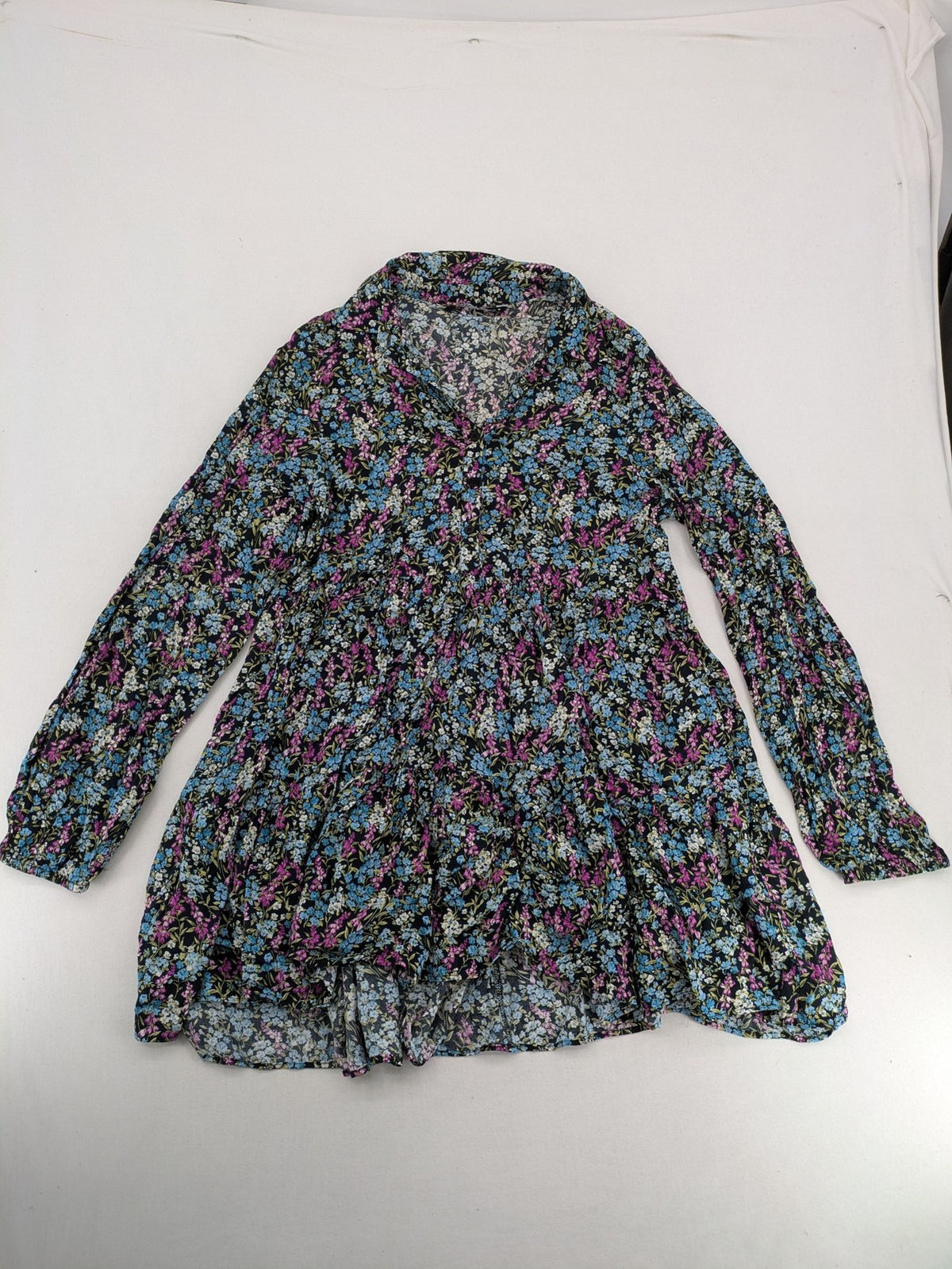Zara multi-coloured floral mini dress with classic collar and button placket on black background.