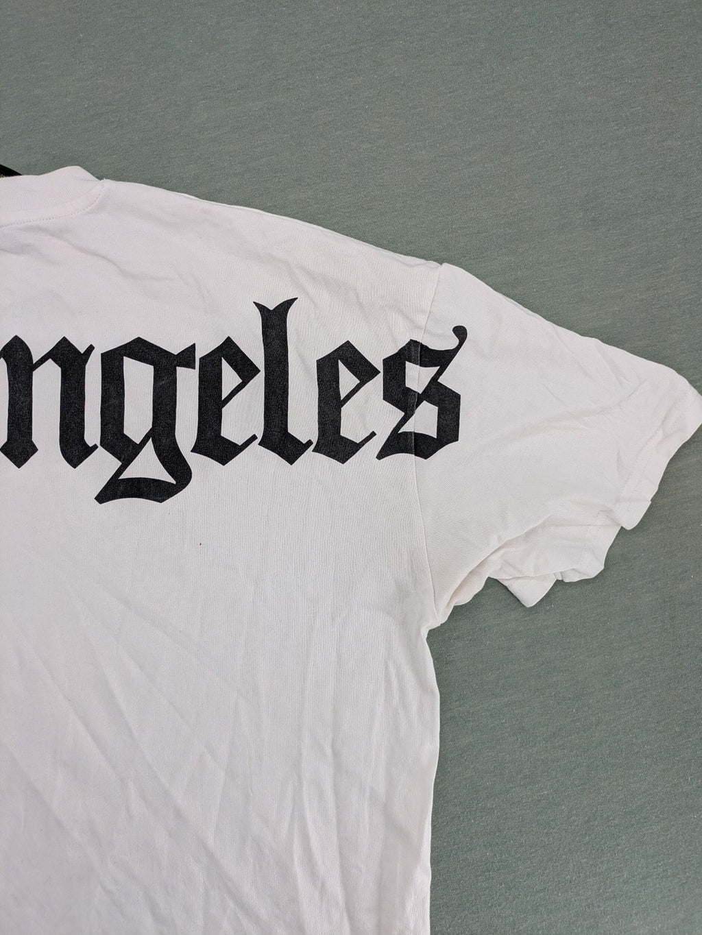 Black Squad black oversized t-shirt with white "Los Angeles" backprint and cotton material.