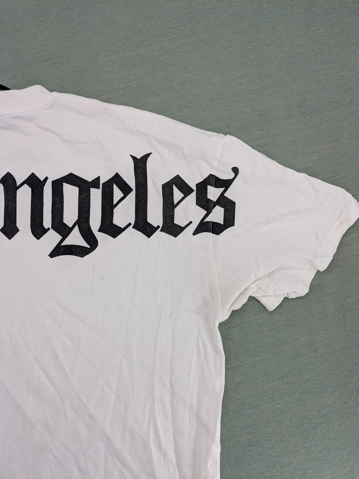 Black Squad black oversized t-shirt with white "Los Angeles" backprint and cotton material.