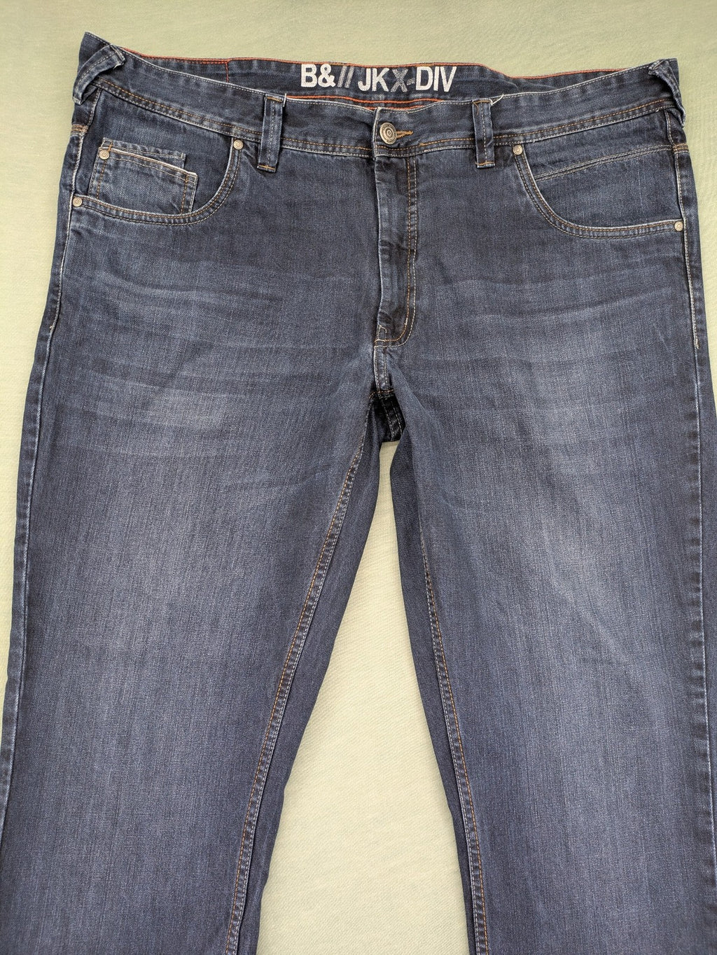 Canda blue straight jeans with five-pocket design and dark wash denim.