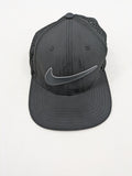 Nike Heritage86 black snapback cap with perforated design and prominent Swoosh logo.