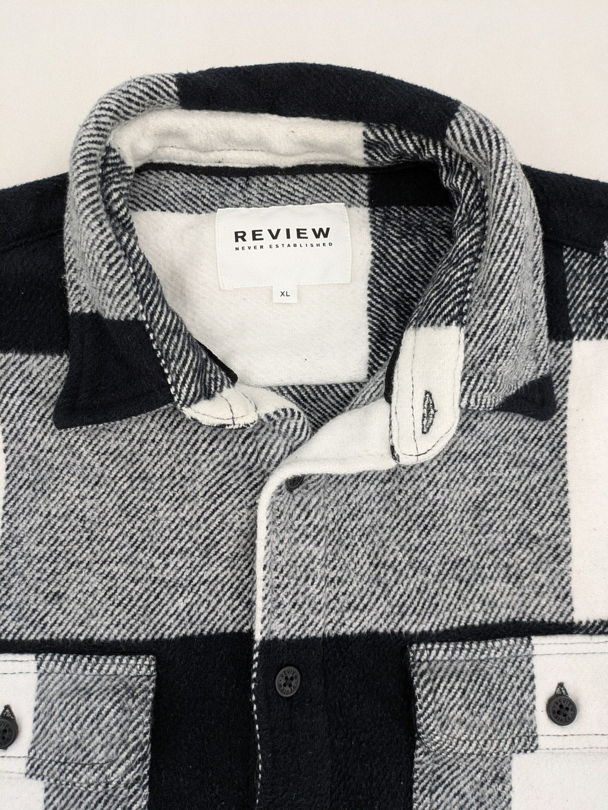 Review flannel jacket black white checkered pattern cotton material with chest pockets