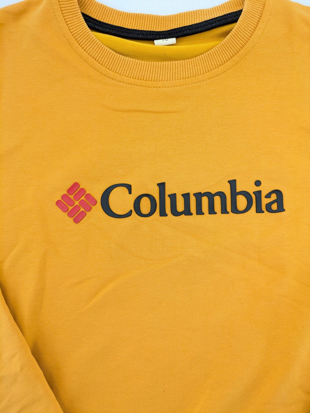 Columbia yellow turtle neck jumper with iconic logo, ribbed cuffs, and soft cotton material.