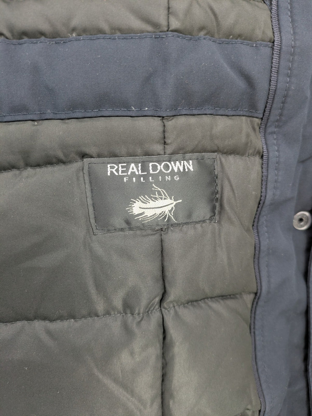 Reset Fifty Seven cream puffer coat with faux fur hood and down insulation.