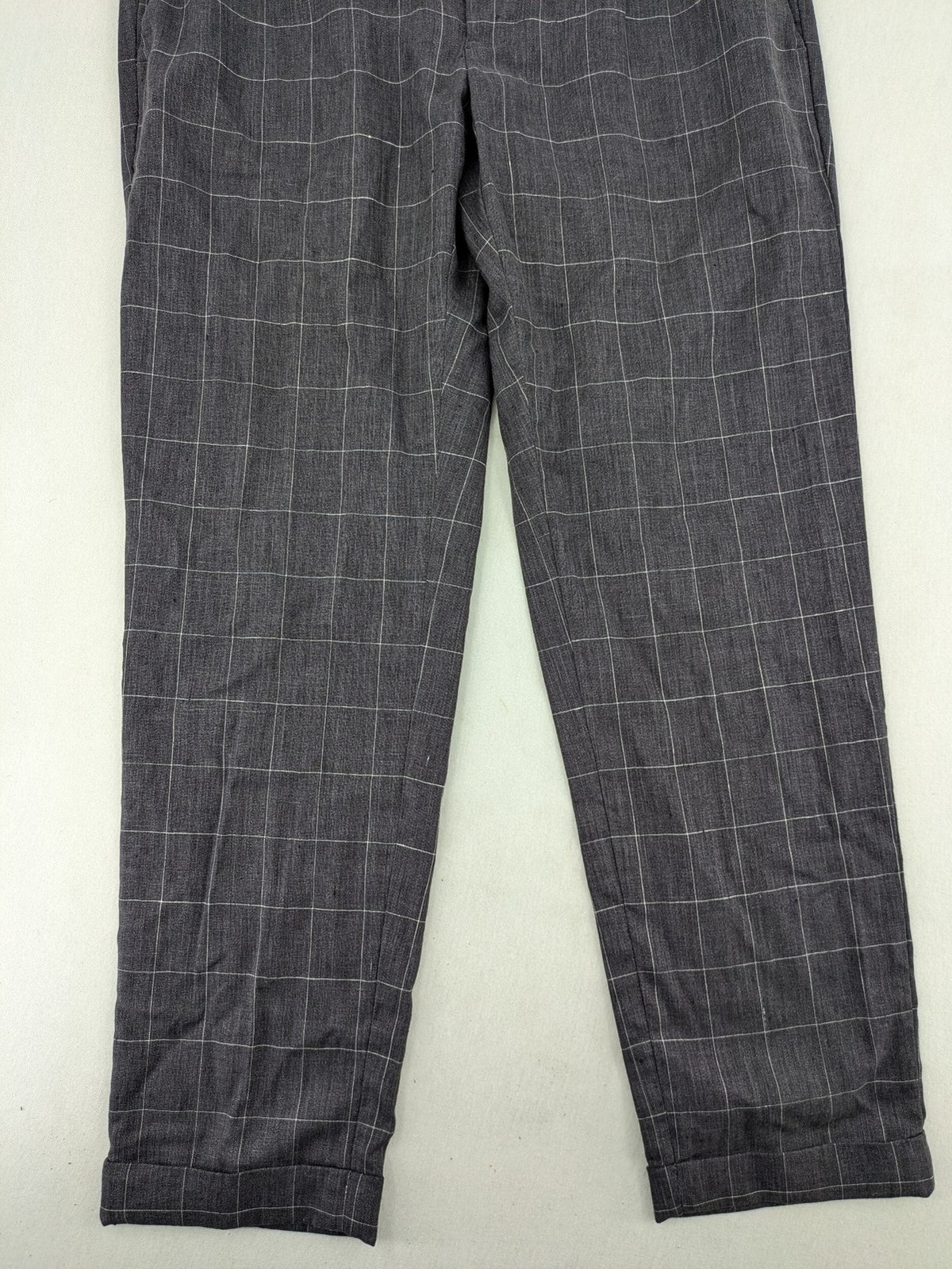MNG Man grey plaid pants with rolled hem and stretch performance material.