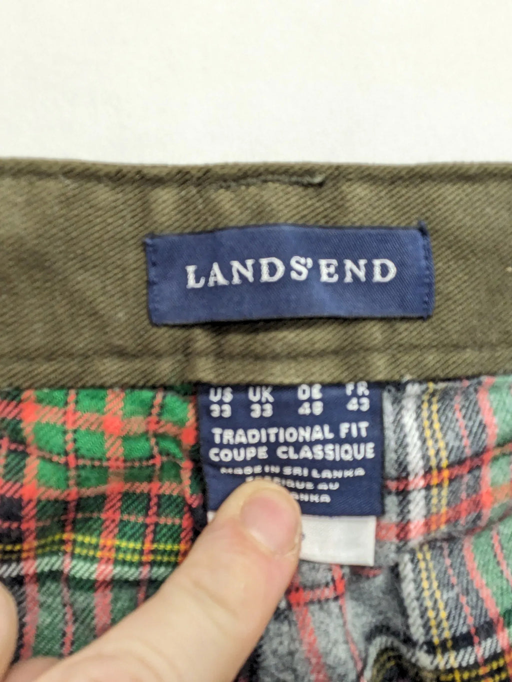 Lands' End green cargo pants with plaid flannel lining and traditional fit design.