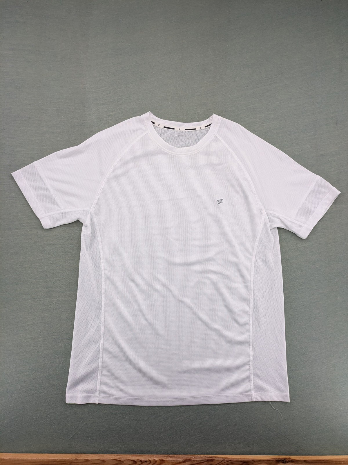 Smilodox white workout t-shirt with logo on chest and reflective detail on back.