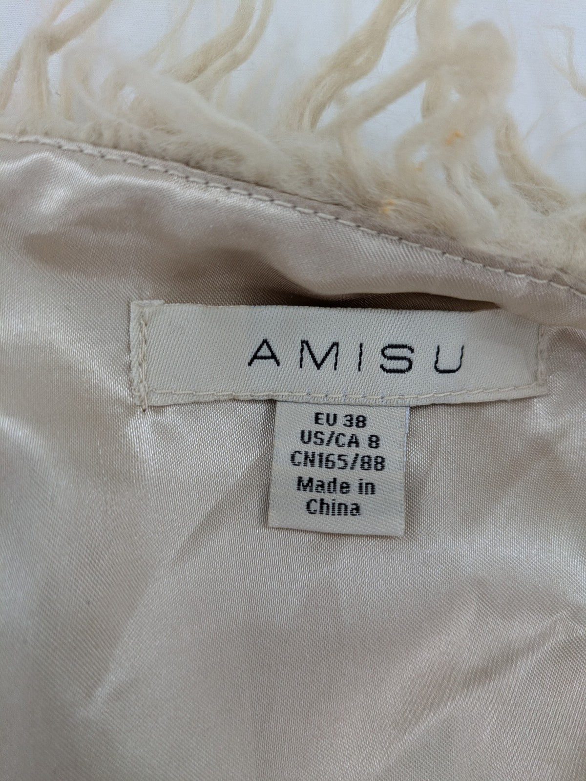 Amisu beige shaggy vest, sleeveless, soft faux fur, open front design.