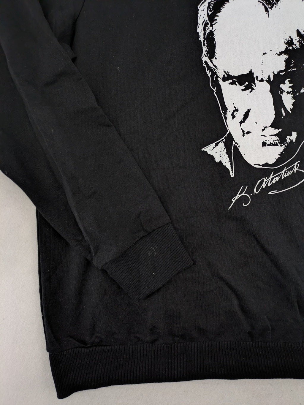 LC Waikiki black turtle neck jumper featuring Atatürk graphic print and signature.