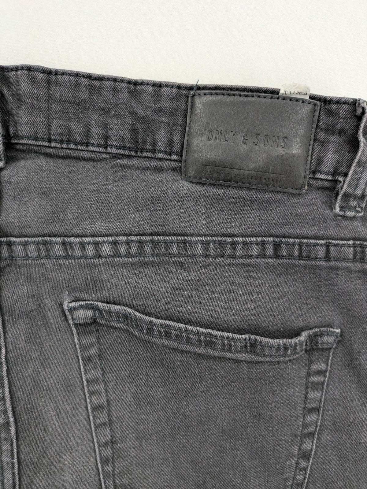 Only & Sons grey slim fit jeans with ripped details and open hem, stretch denim.