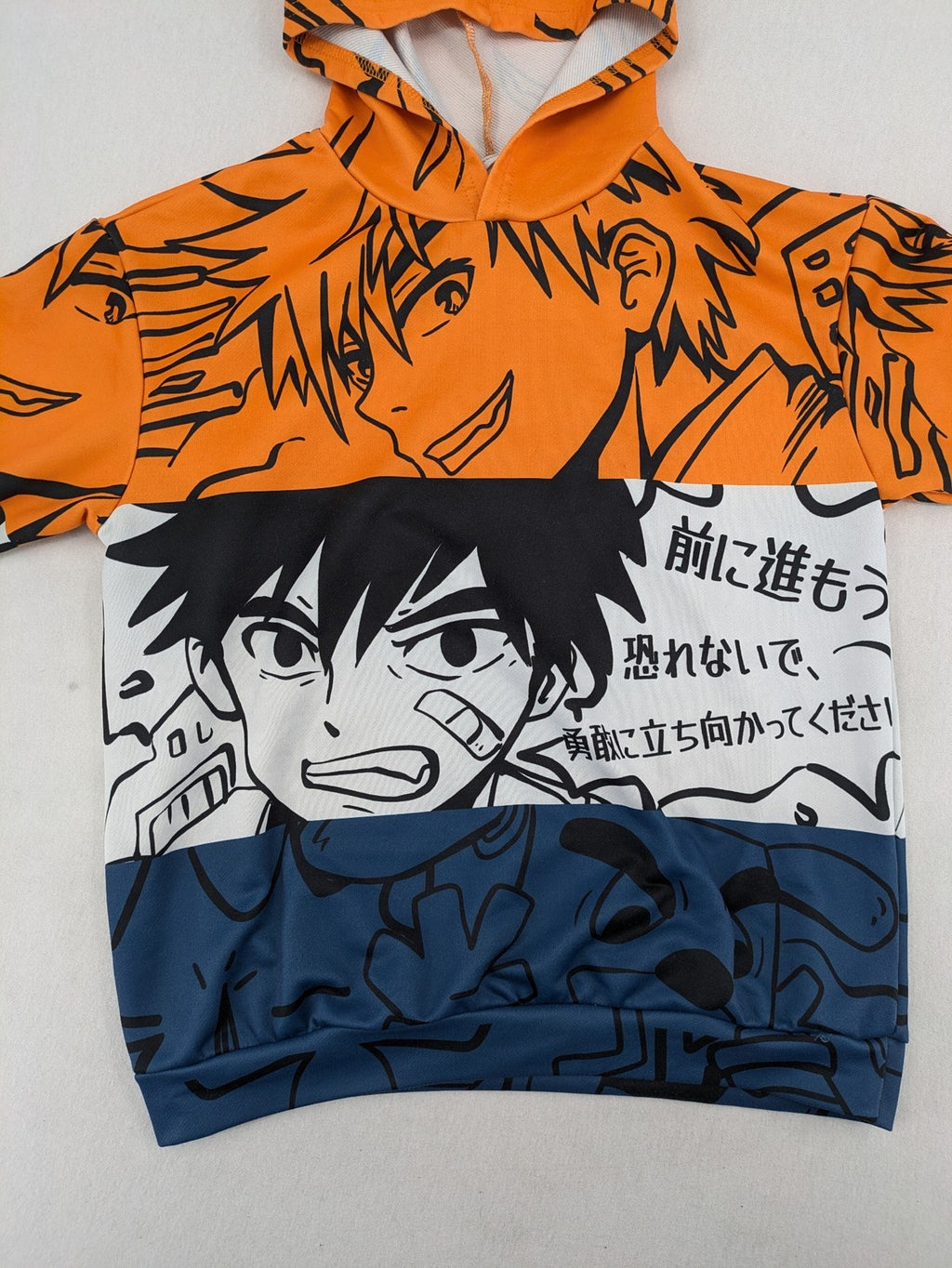 SHEIN orange zip-through hoodie with vibrant anime graphic print and colorblock design.