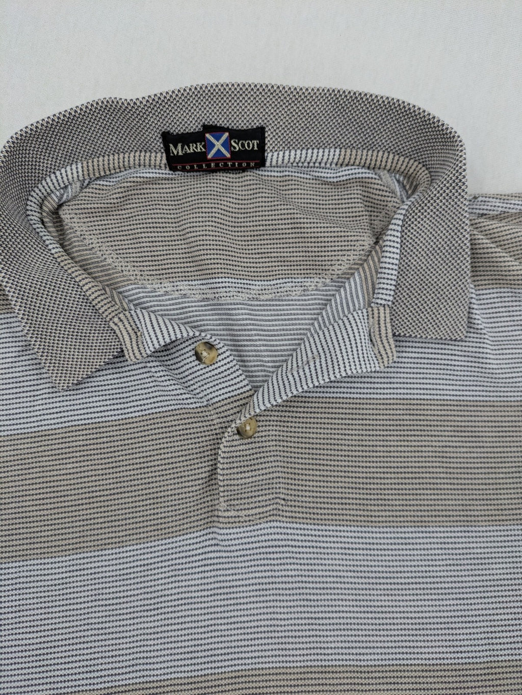 Mark Scot Collection grey and tan striped polo shirt with classic collar and logo.