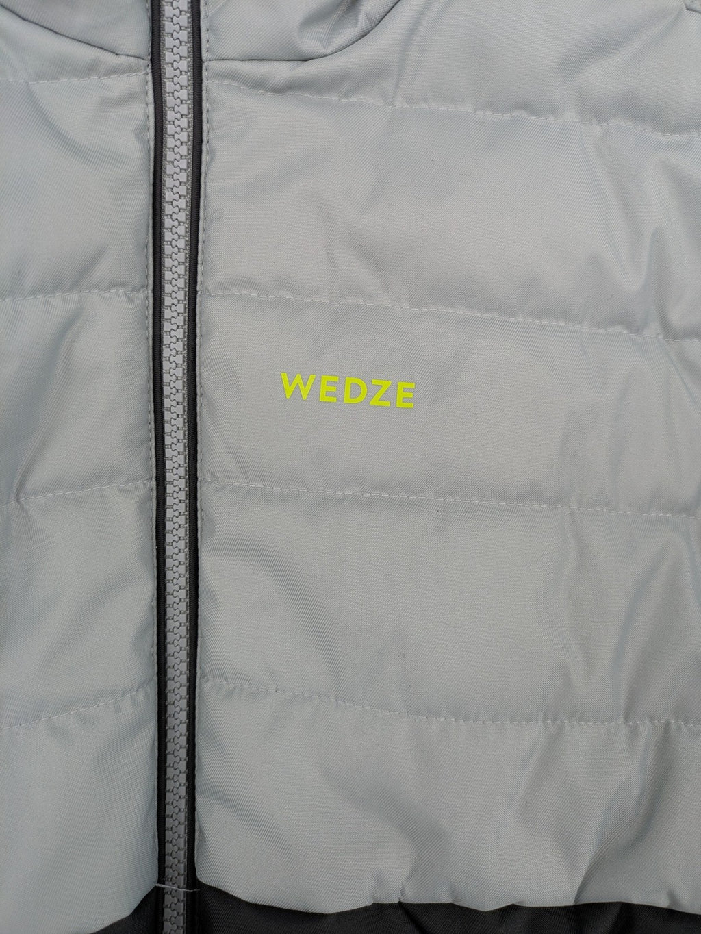 Wedze ski coat grey and black colorblock design with neon accents and fleece lining.