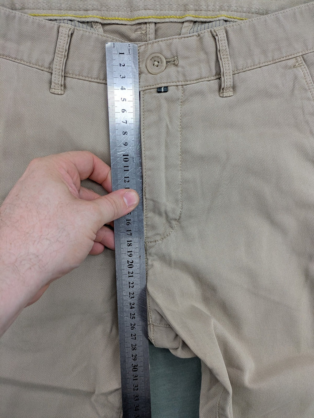 Marc O'Polo beige tapered fit chino pants, soft cotton stretch fabric, modern silhouette.