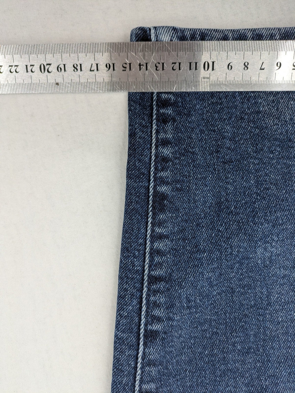 Levi's high waisted taper jeans dark blue 5-pocket design with zipper and stretch material.