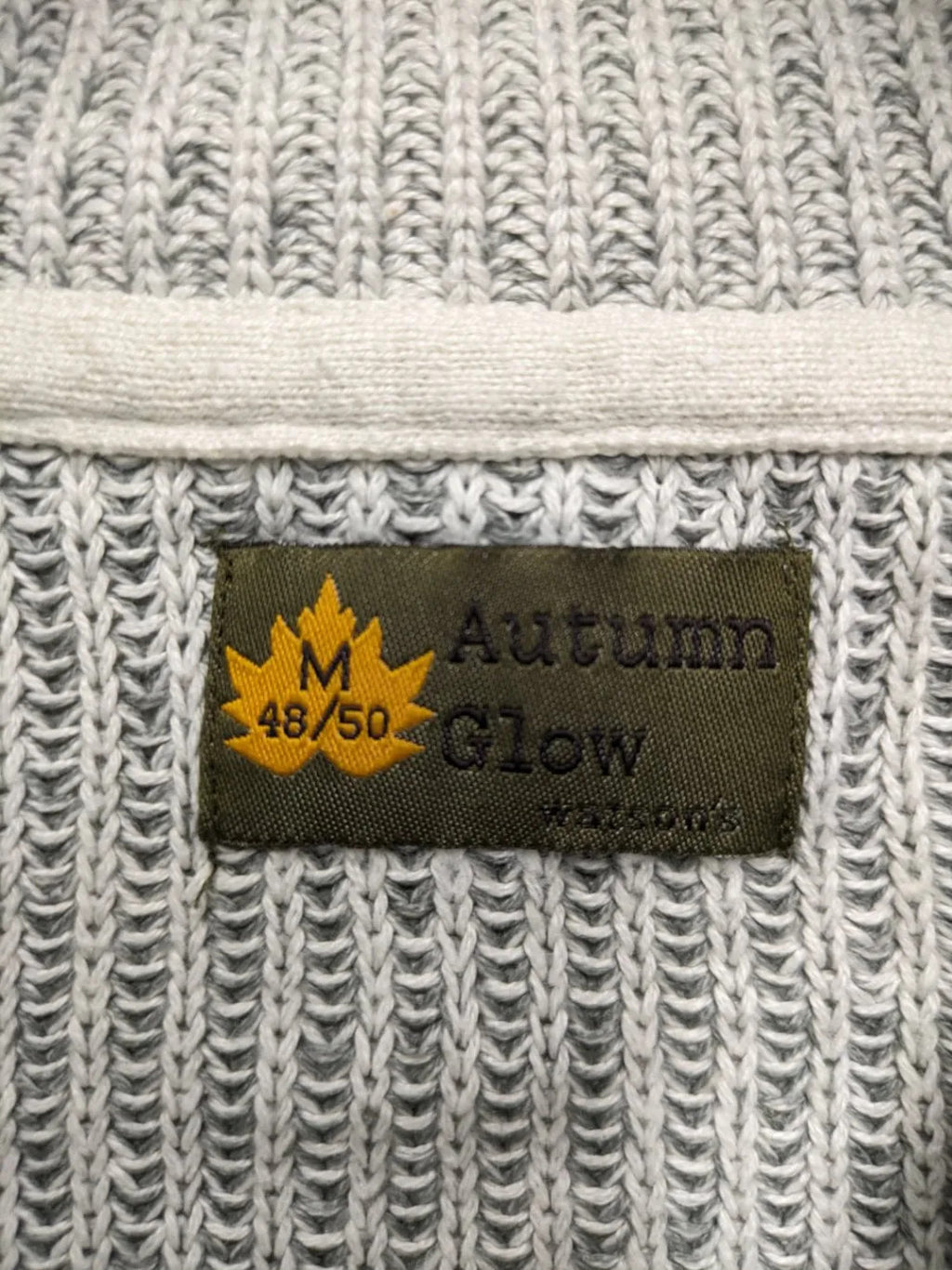 Autumn Glow grey turtle neck jumper with ribbed pattern and button detail.