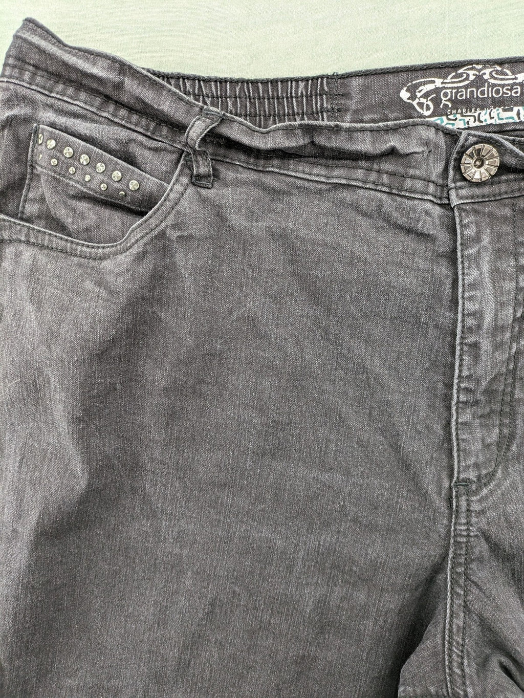 Charles Vögele grey straight jeans with elastic waistband and decorative studs on pockets.