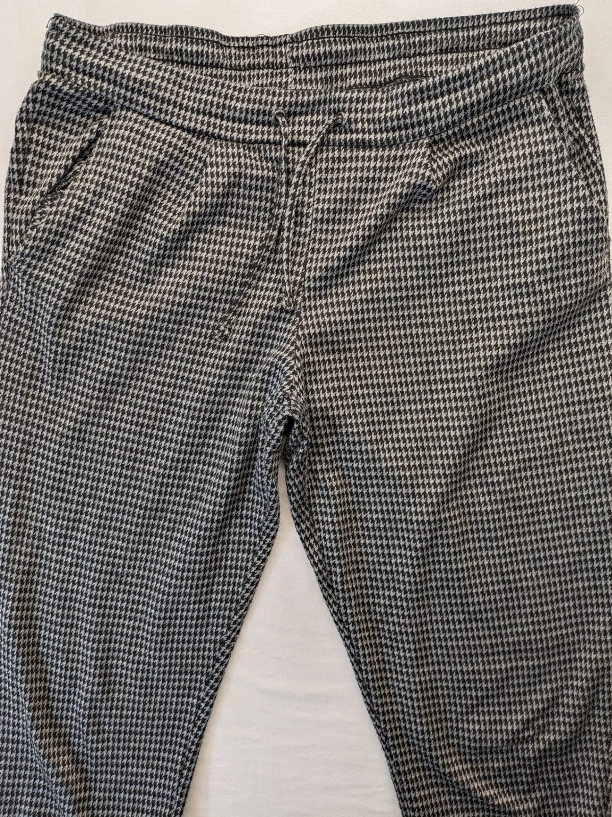 UP2FASHION beige and brown houndstooth pants with adjustable drawstring and soft stretch material.