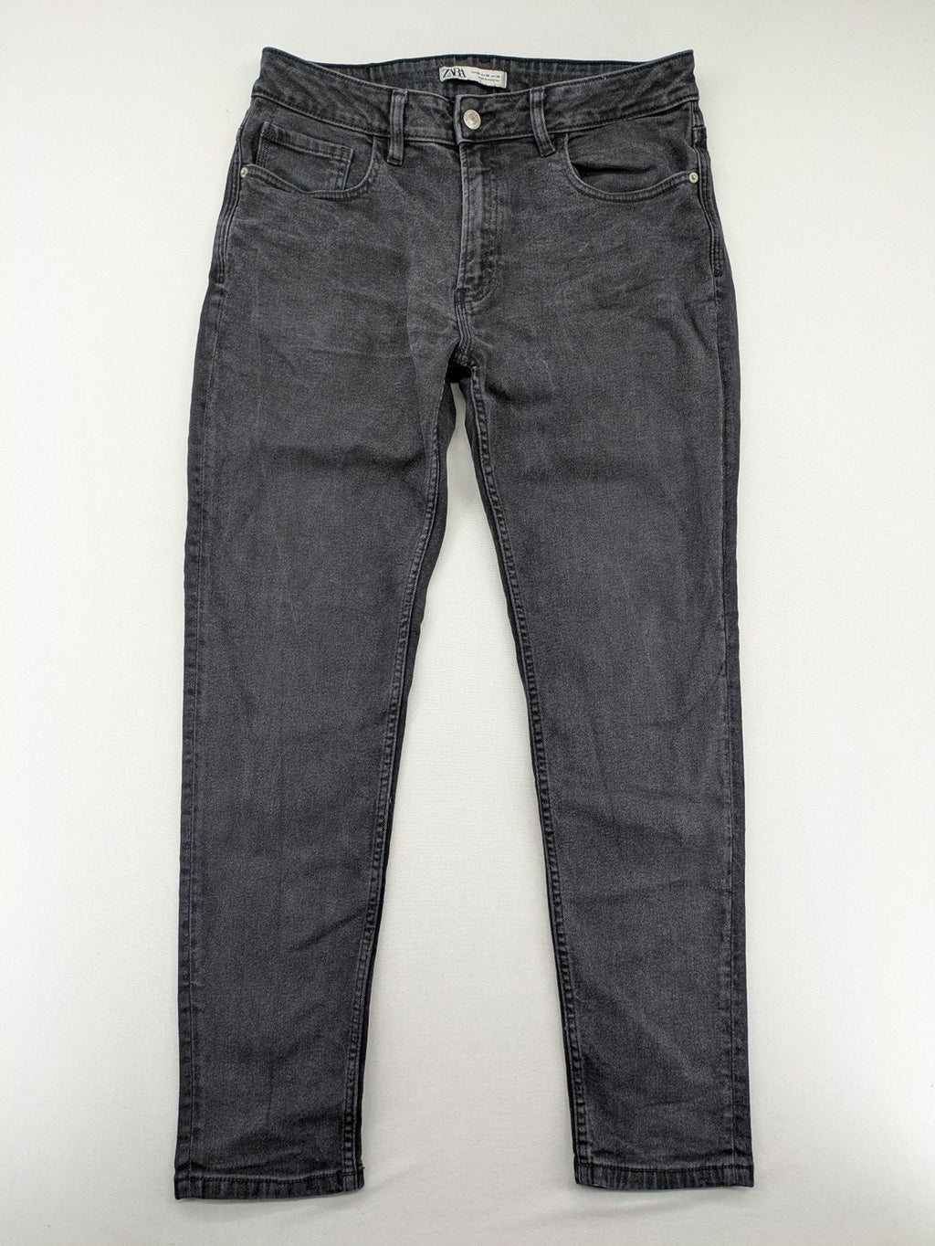 Zara black straight jeans faded wash five-pocket design with zipper closure.