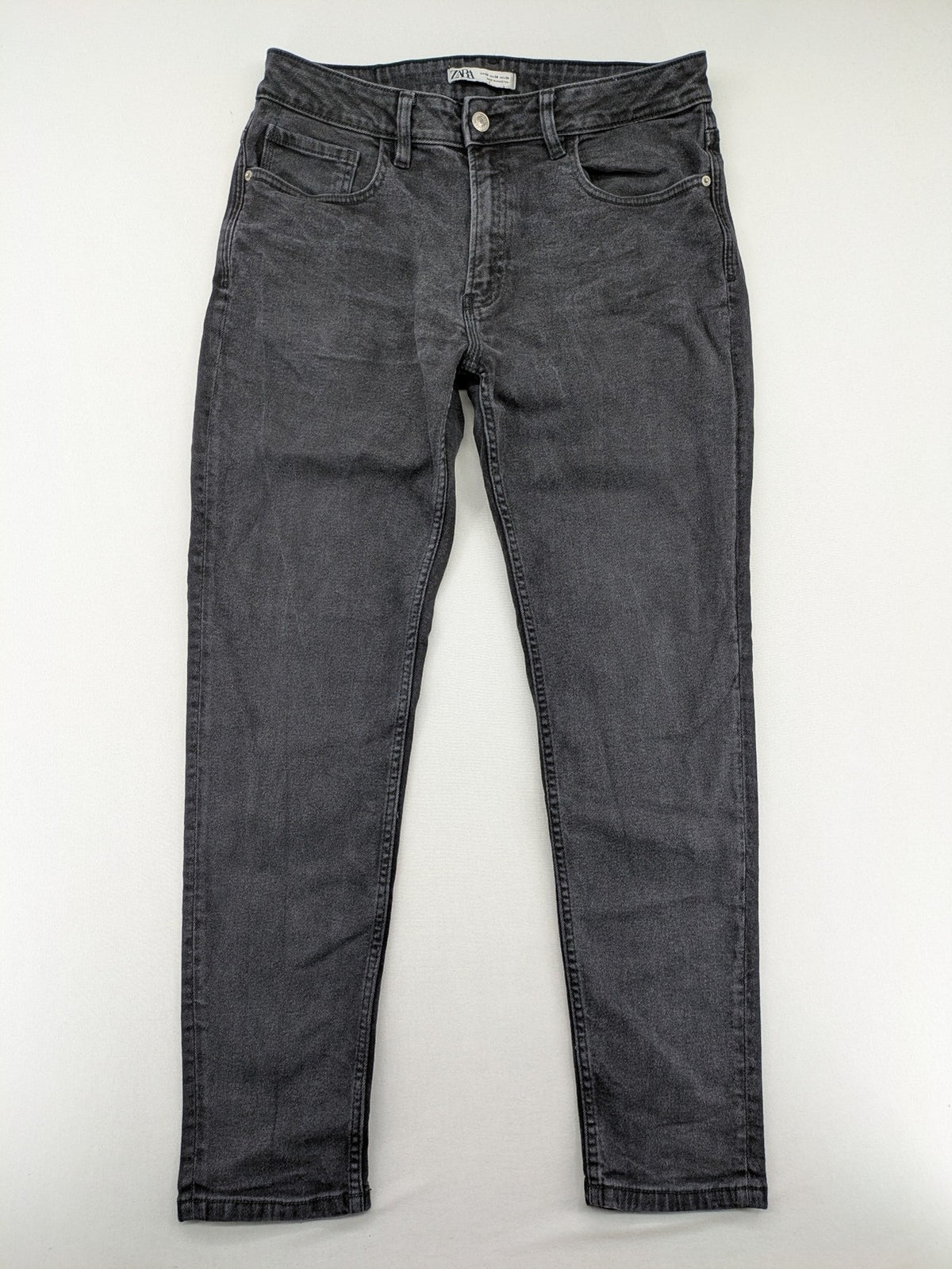 Zara black straight jeans faded wash five-pocket design with zipper closure.