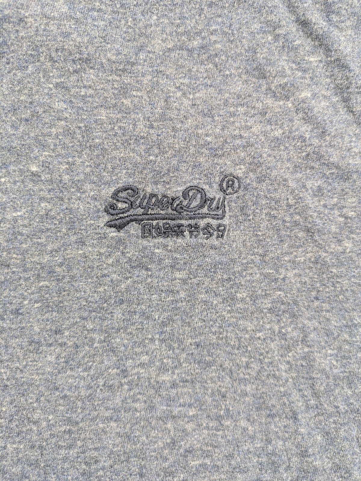 Superdry grey long sleeve shirt melange with embroidered logo and red collar accent.